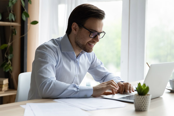 Man working on their laptop